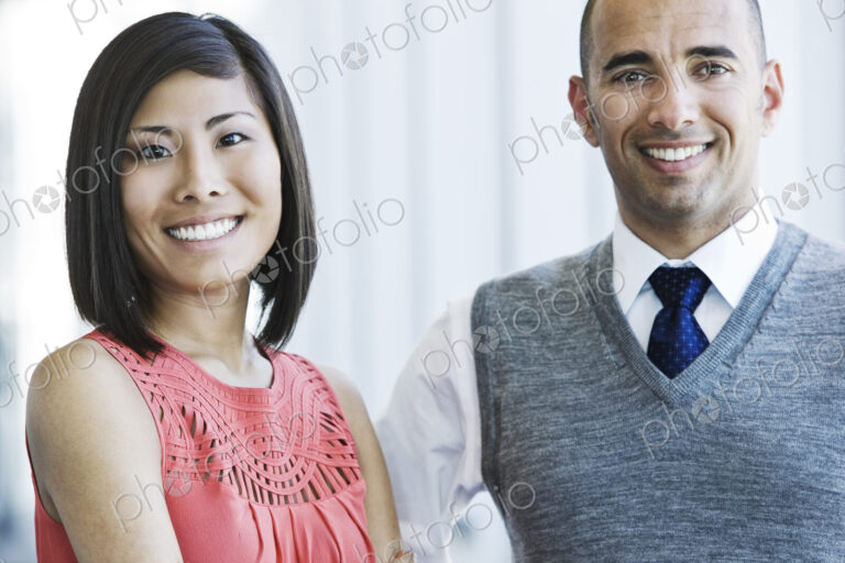 Portrait of an asian businesswoman and hispanic businessman.