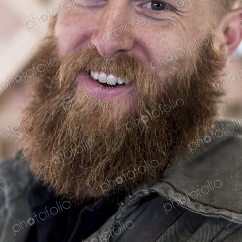 Portrait of smiling bearded man with light brown hair. Portrait of smiling bearded man with light brown hair.
