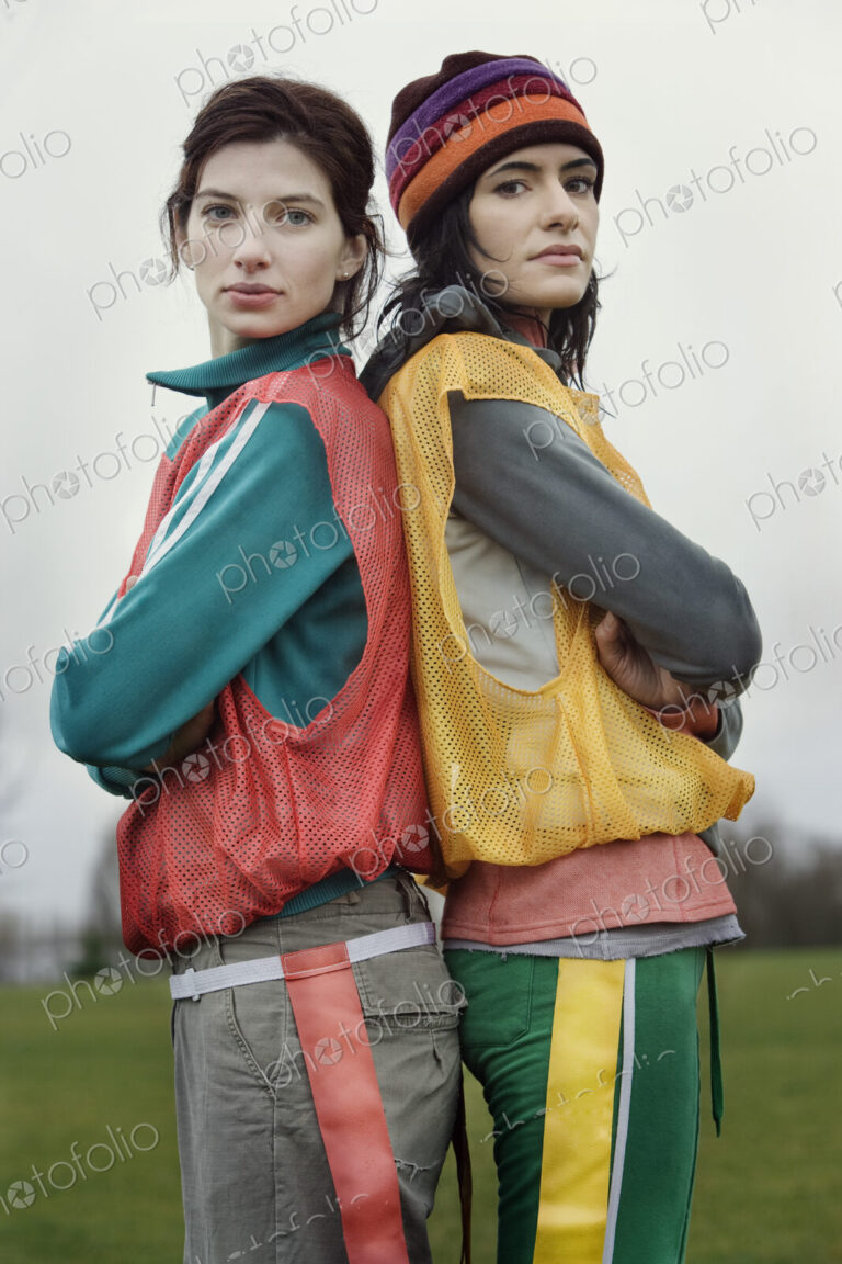 Portrait of two caucasian women who play sports outside in the winter.