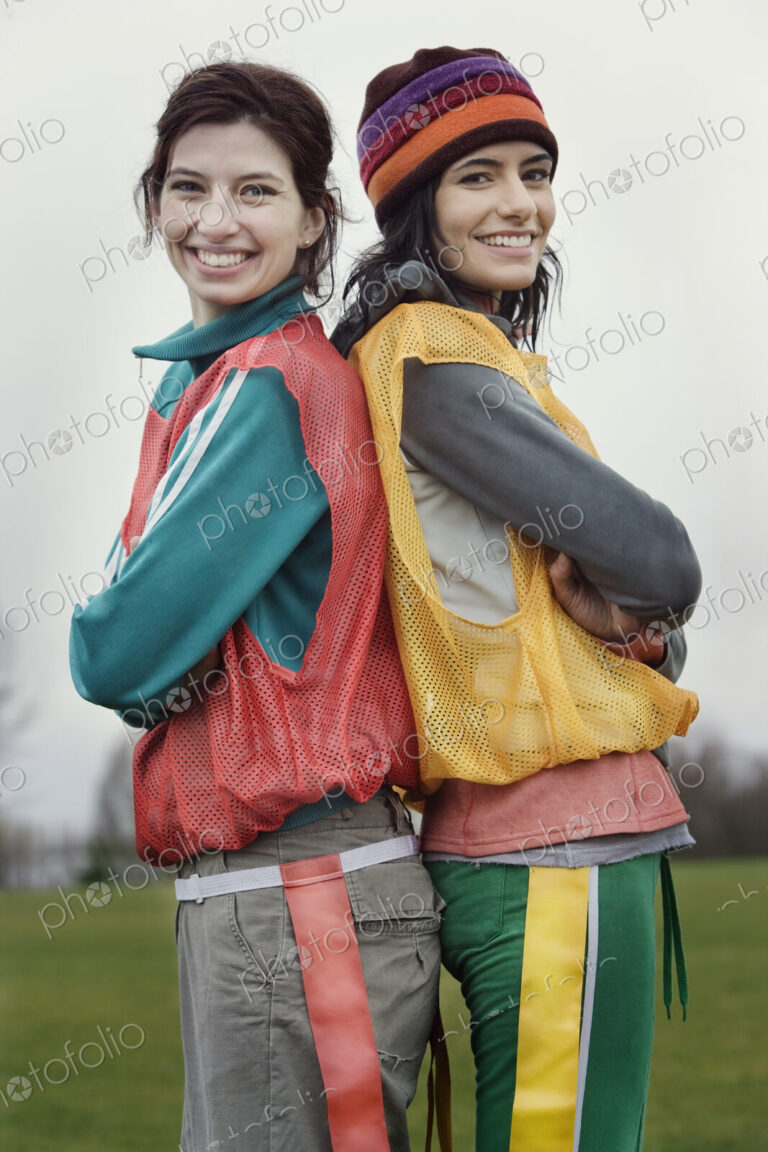 Portrait of two caucasian women who play sports outside in the winter.