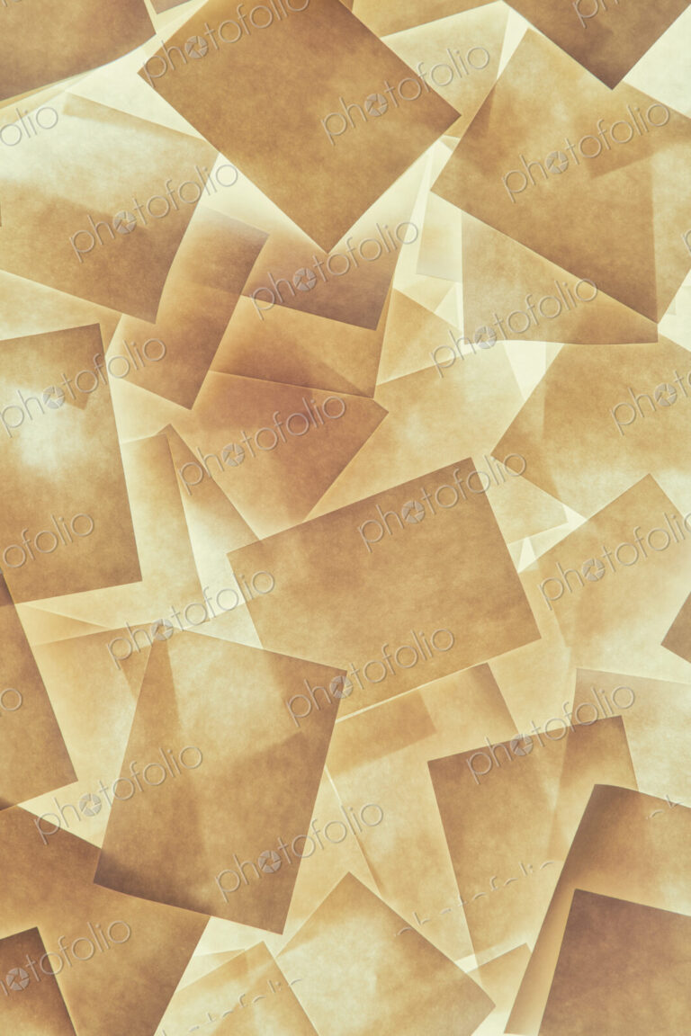 Post it notes arranged and overlapping, above a light source.