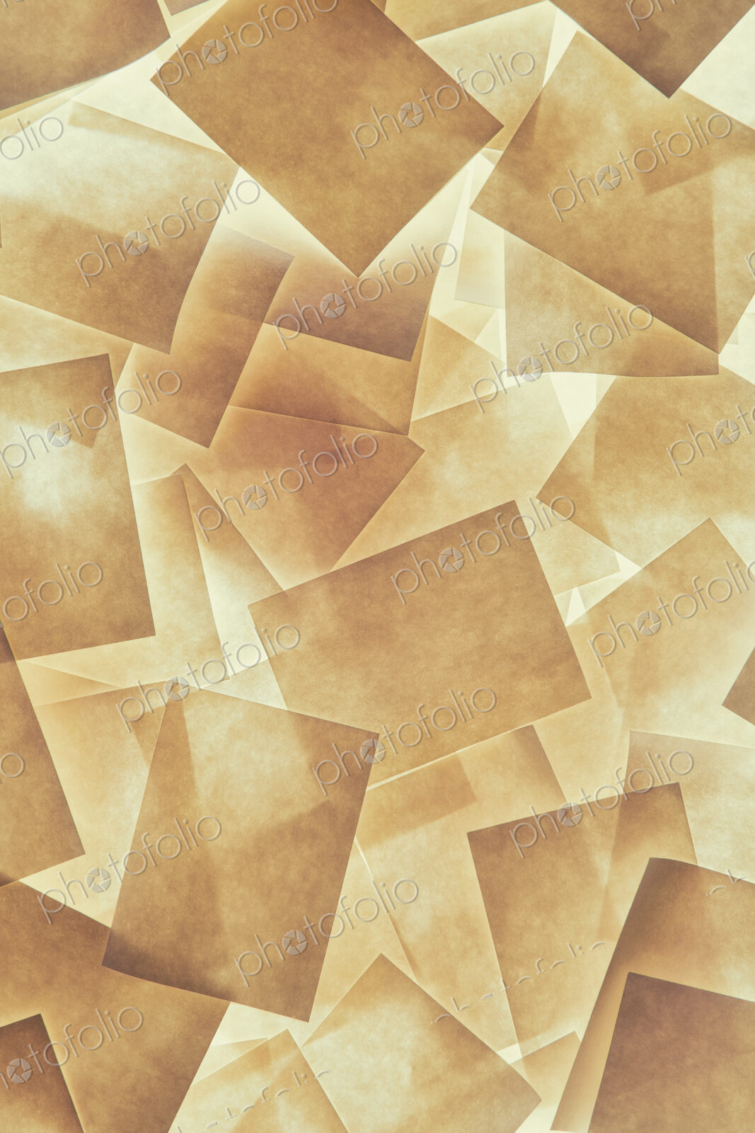 Post it notes arranged and overlapping, above a light source.