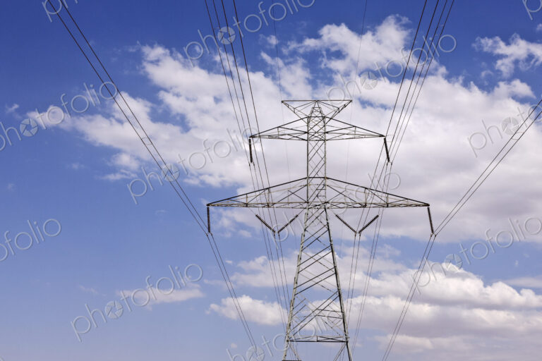 Power Pylon Under Clouds