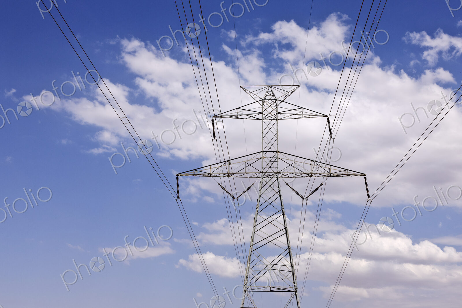 Power Pylon Under Clouds