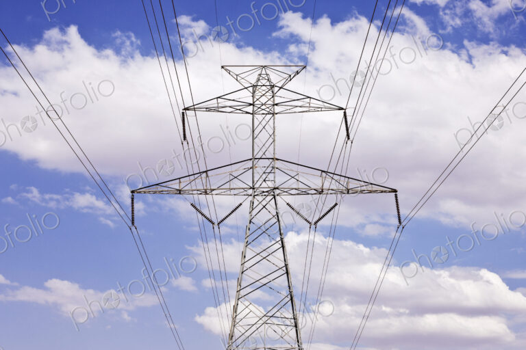 Power Pylon Under Clouds