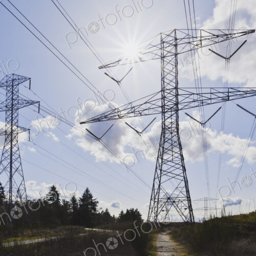 Power lines against blue sky