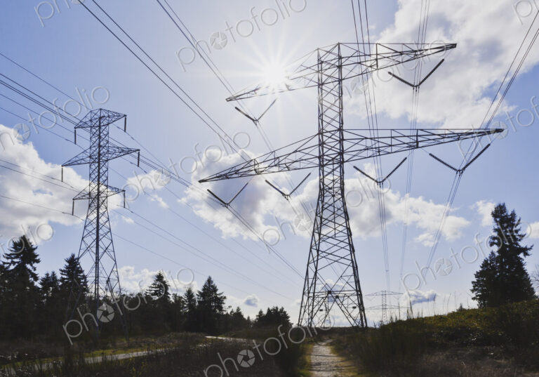 Power lines against blue sky