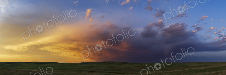 Prairie Sunset in the Nebraska Sandhills, cloud formations, a sunset glow and small…