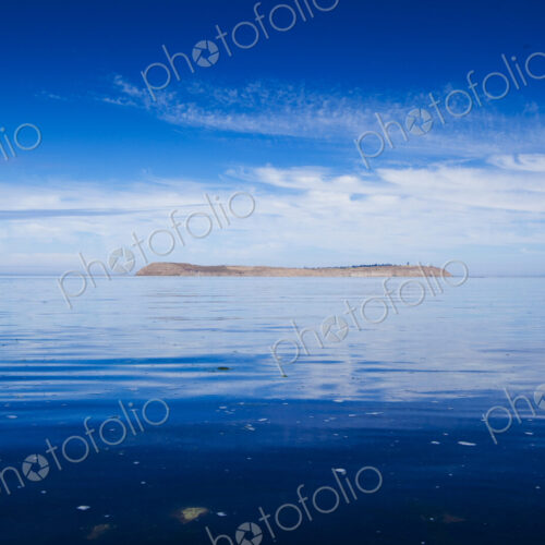 Protection Island, Puget Sound, view from a distance over calm seas. Protection Island, Puget Sound, view from a distance over calm seas.