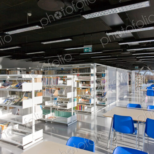 Public Library Interior, modern building with book shelves Public Library Interior, modern building with book shelves