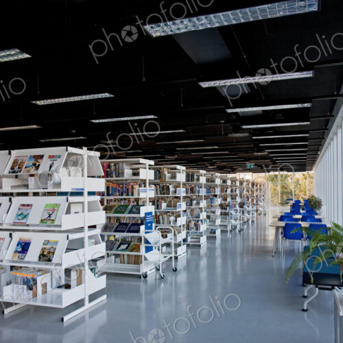 Public library, modern interior with shelves of books Public library, modern interior with shelves of books