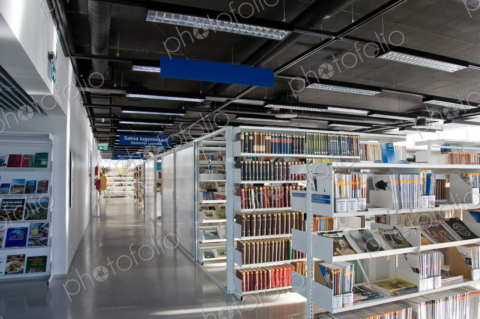 Public library, modern interior with shelves of books