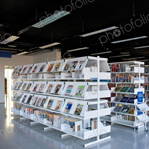 Public library, modern interior with shelves of books Public library, modern interior with shelves of books