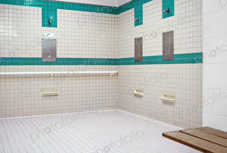 Public shower room for use before entering the swimming pool area at a recreation centre.