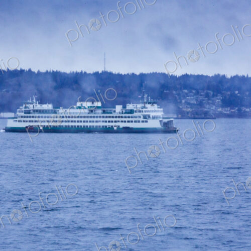 Puget Sound ferry crossing from Edmonds to Kingston, view through a window with raindrops. Puget Sound ferry crossing from Edmonds to Kingston, view through a window with raindrops.