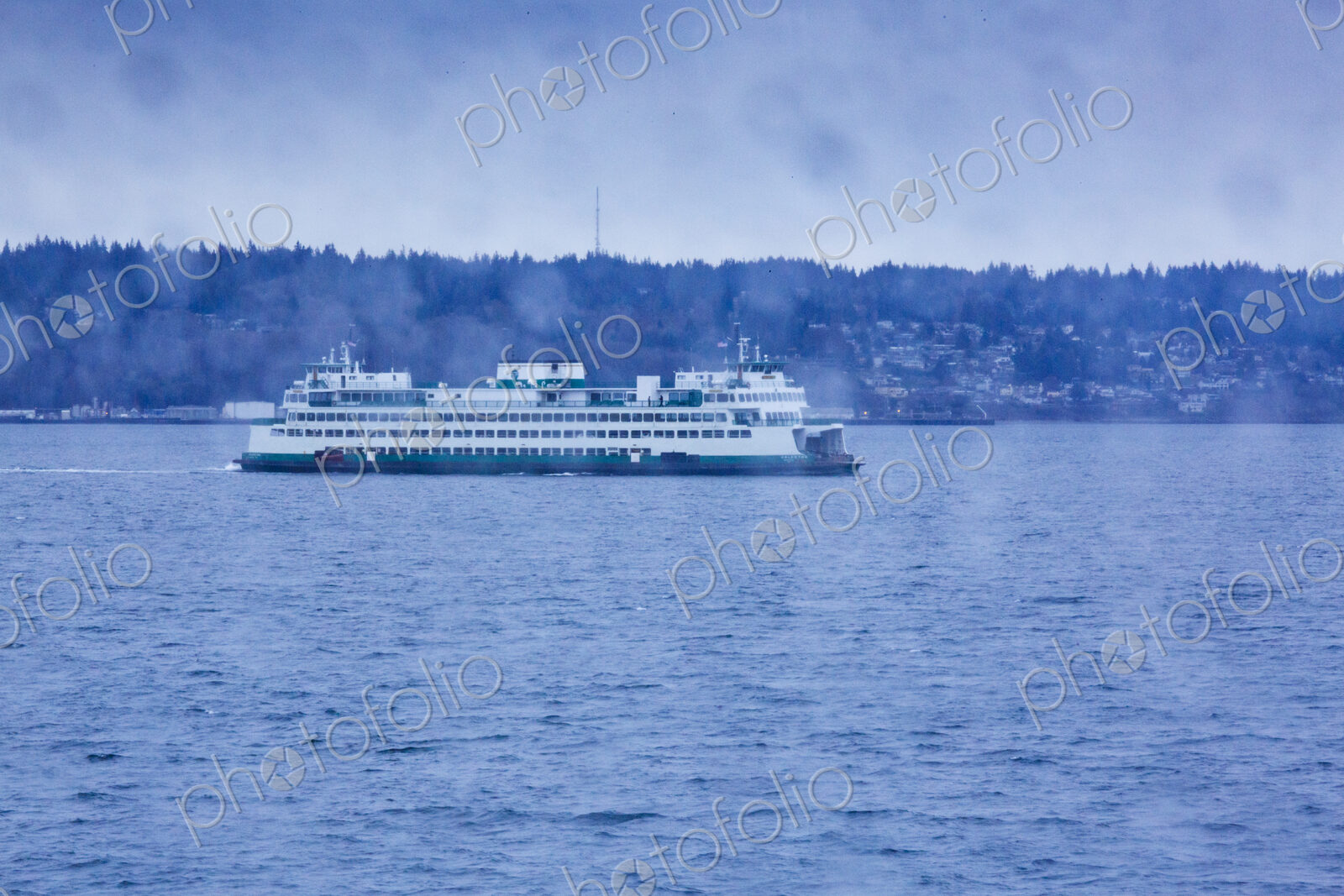 Puget Sound ferry crossing from Edmonds to Kingston, view through a window with raindrops.