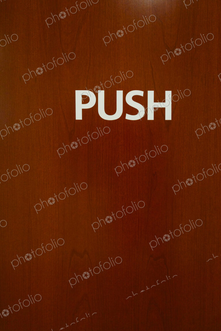 Push sign on wooden door, USA