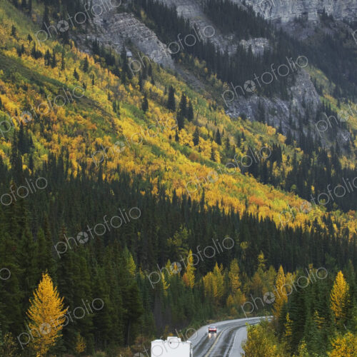 R.V. driving on road through remote mountains R.V. driving on road through remote mountains