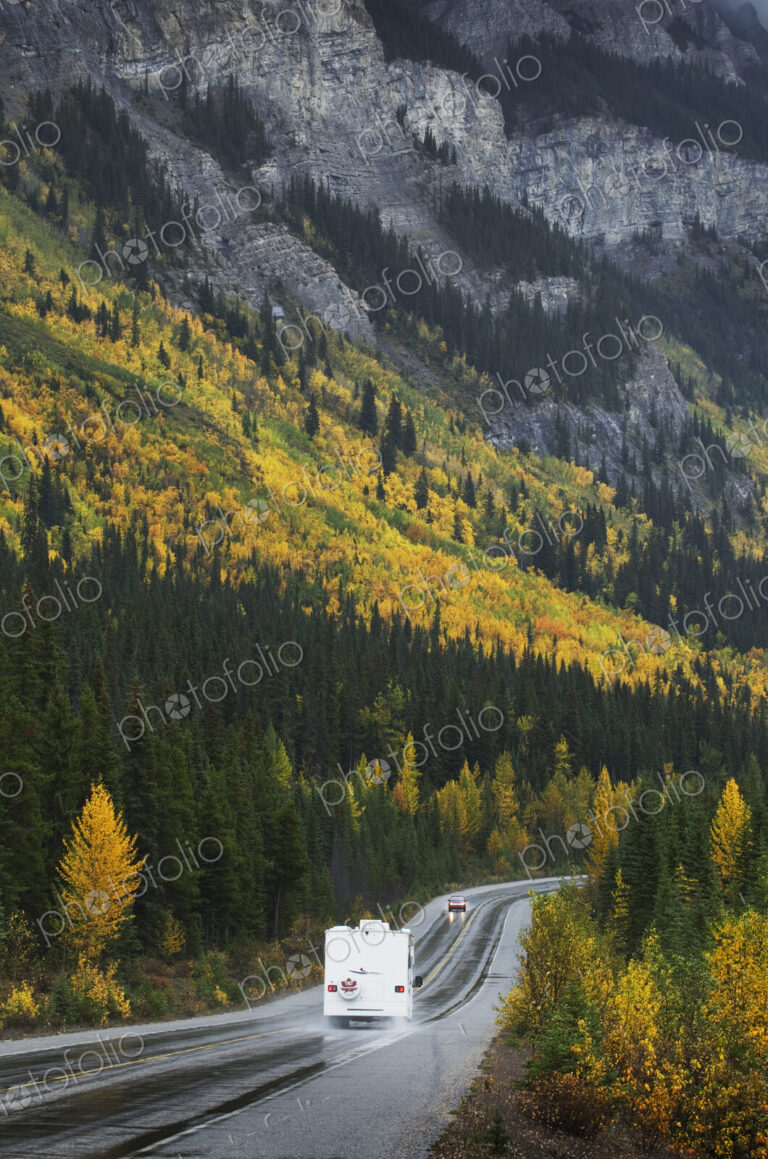 R.V. driving on road through remote mountains