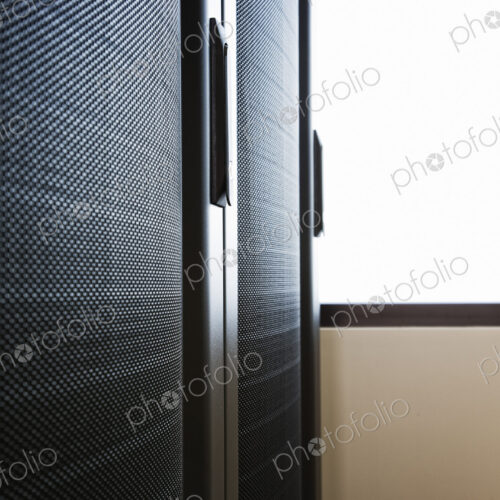 Rack housing servers in computer server farm Rack housing servers in computer server farm