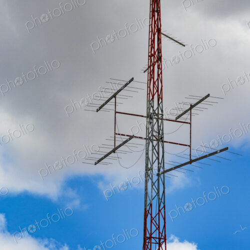 Radio antennae a central metal pole and aerials with a shaped metal skeleton dish at… Radio antennae a central metal pole and aerials with a shaped metal skeleton dish at…