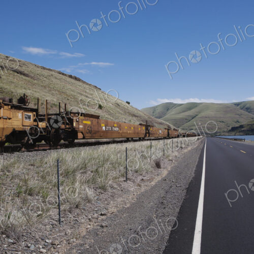Railroad cars and highway along the Snake River canyon near Wawawai, in Washington…