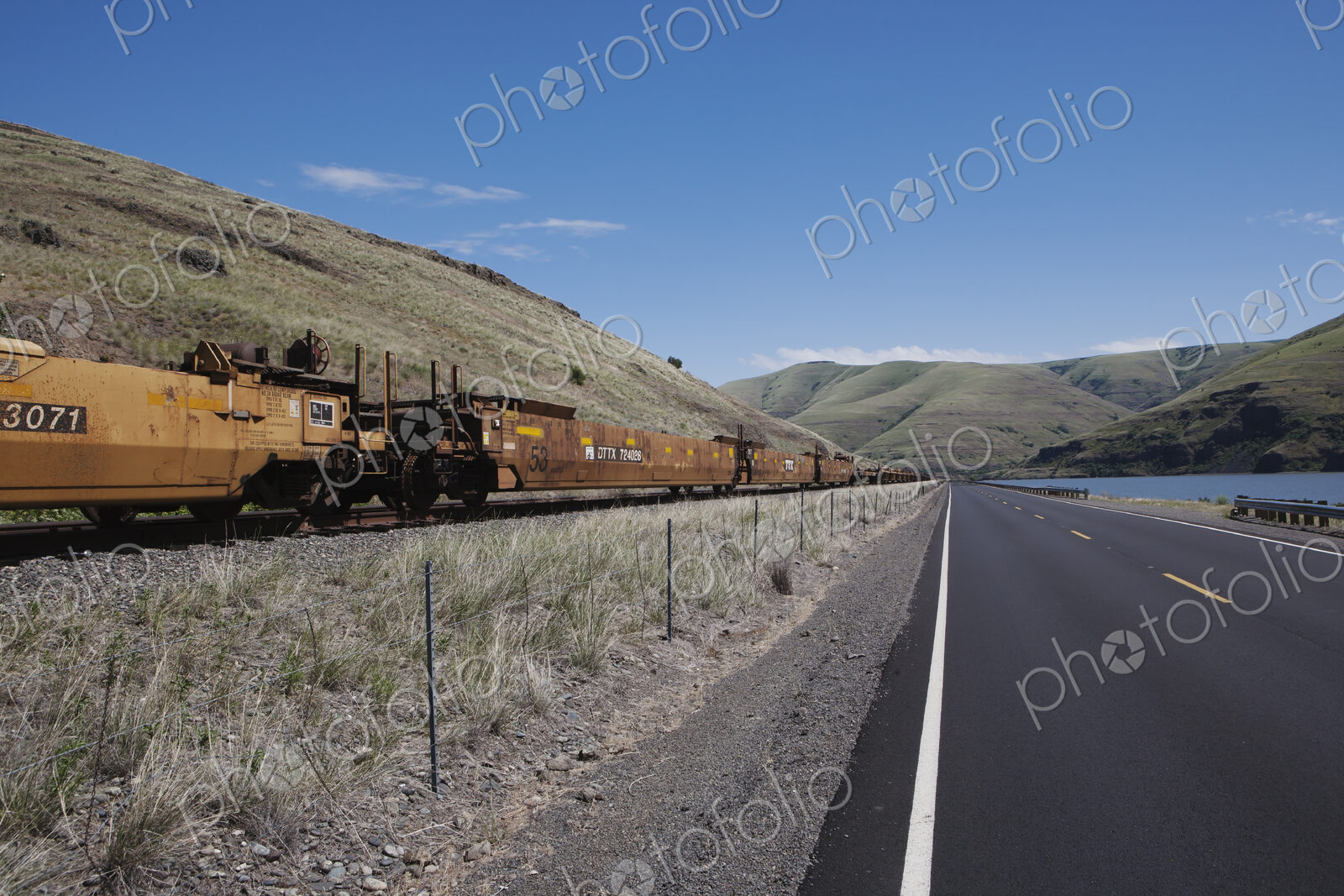 Railroad cars and highway along the Snake River canyon near Wawawai, in Washington…