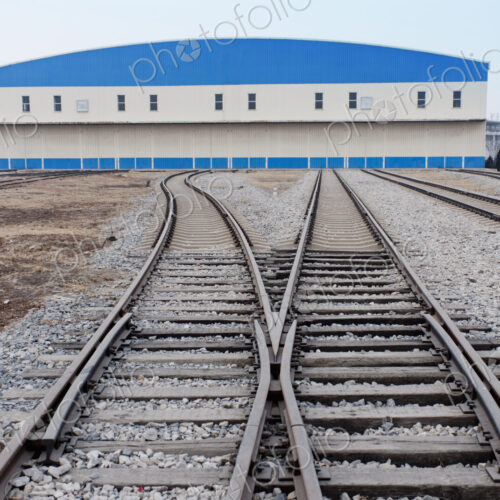 Railway shed with blue roof and sidings. Railway shed with blue roof and sidings.