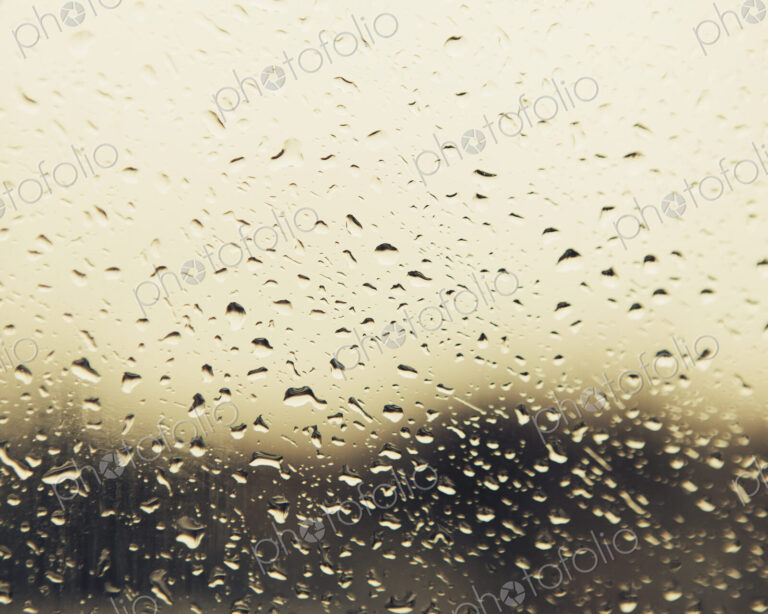Rain water droplets on a window. View through the window on a rainy day. Seattle