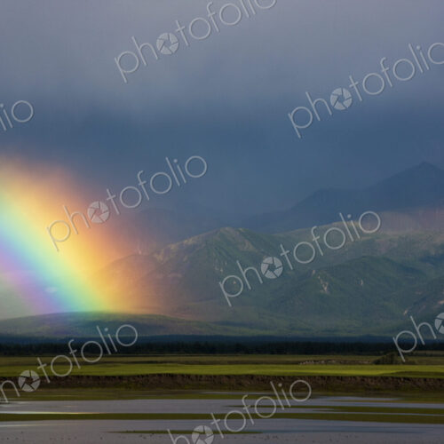 Rainbow over the steppe landscape, Mongolia Rainbow over the steppe landscape, Mongolia