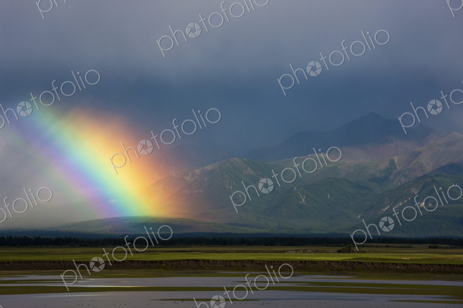 Rainbow over the steppe landscape, Mongolia