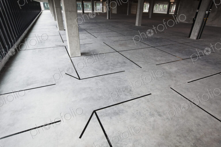 Raw office space with new offices outlined in tape.