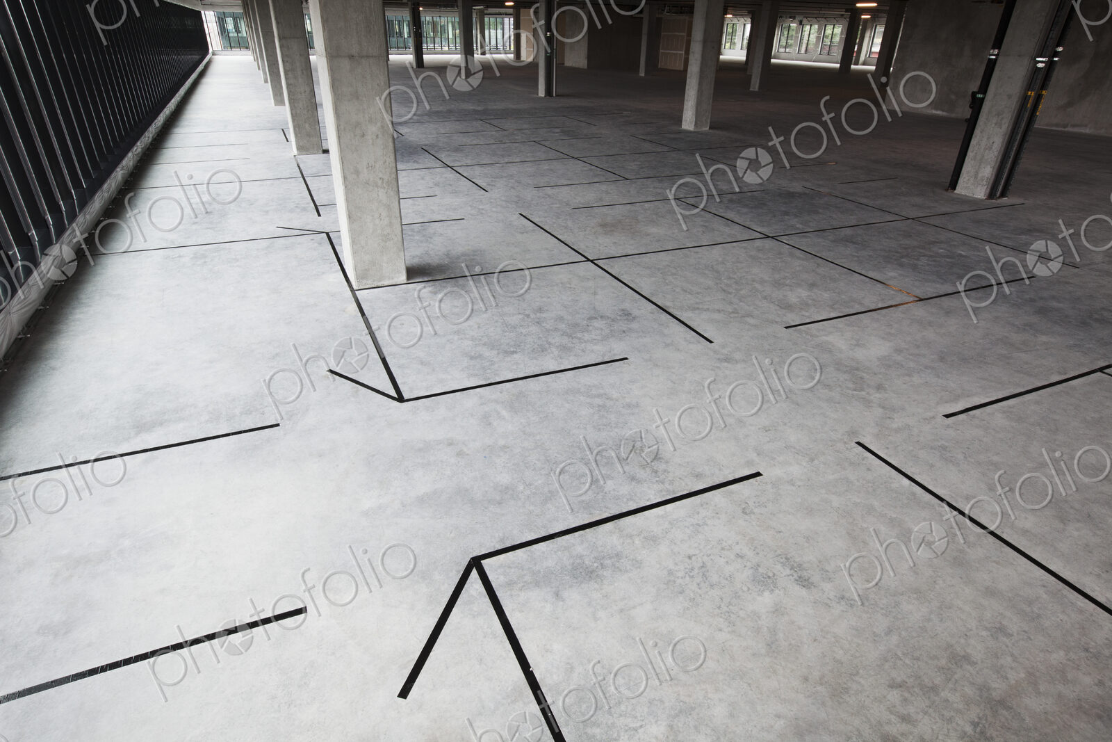 Raw office space with new offices outlined in tape.