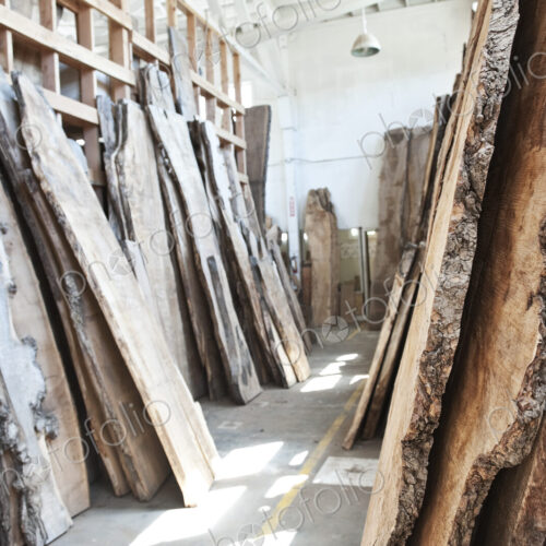 Reclaimed recycled cut slabs of wood in a woodowrking factory.