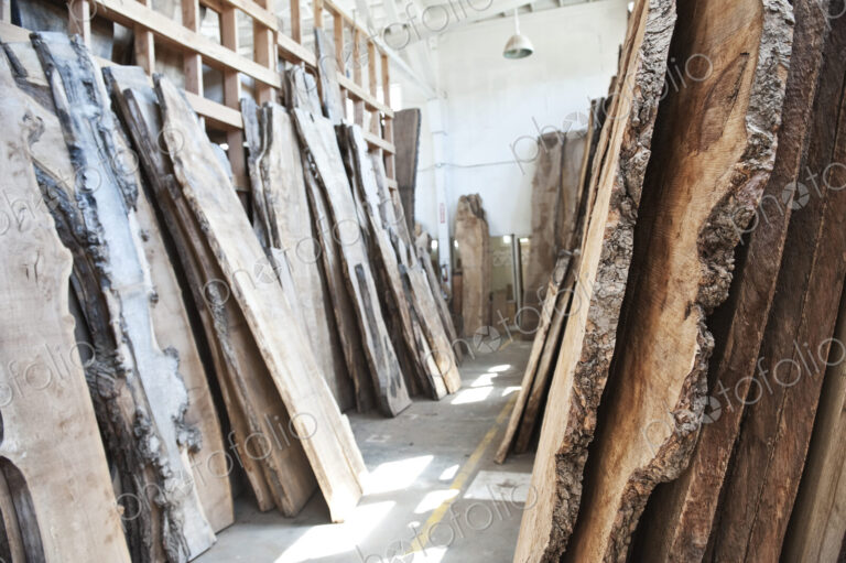Reclaimed recycled cut slabs of wood in a woodowrking factory.