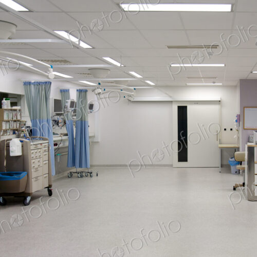 Recovery room in a modern hospital, post-operative recovery, patient bays with curtains Recovery room in a modern hospital, post-operative recovery, patient bays with curtains