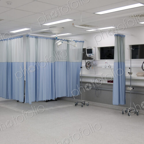 Recovery room in a modern hospital, post-operative recovery, patient bays with curtains Recovery room in a modern hospital, post-operative recovery, patient bays with curtains
