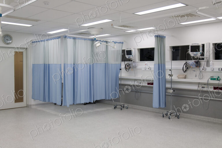 Recovery room in a modern hospital, post-operative recovery, patient bays with curtains