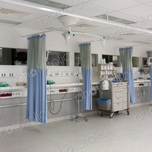 Recovery room outside the operating theatre in a hospital. Drapes, blue curtains…