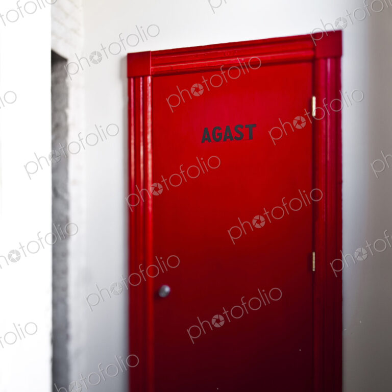 Red Door on a White Wall