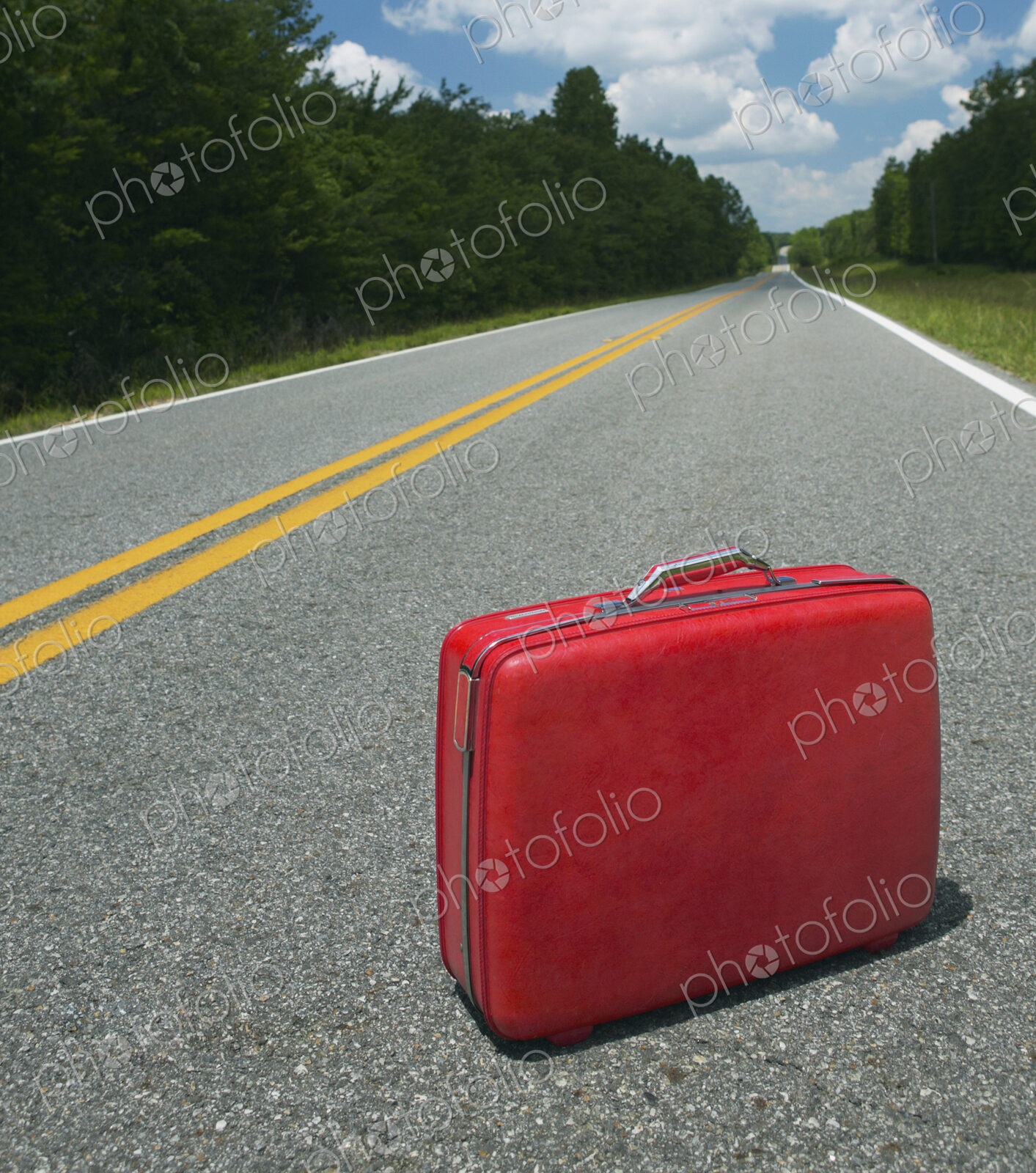 Red Suitcase Abandoned in Road