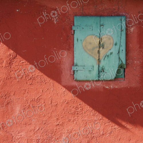 Red Wall with Shuttered Window