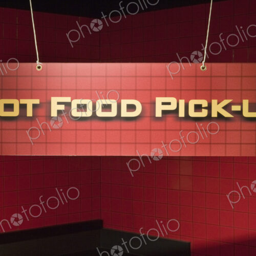 Red hot food pickup hanging sign.