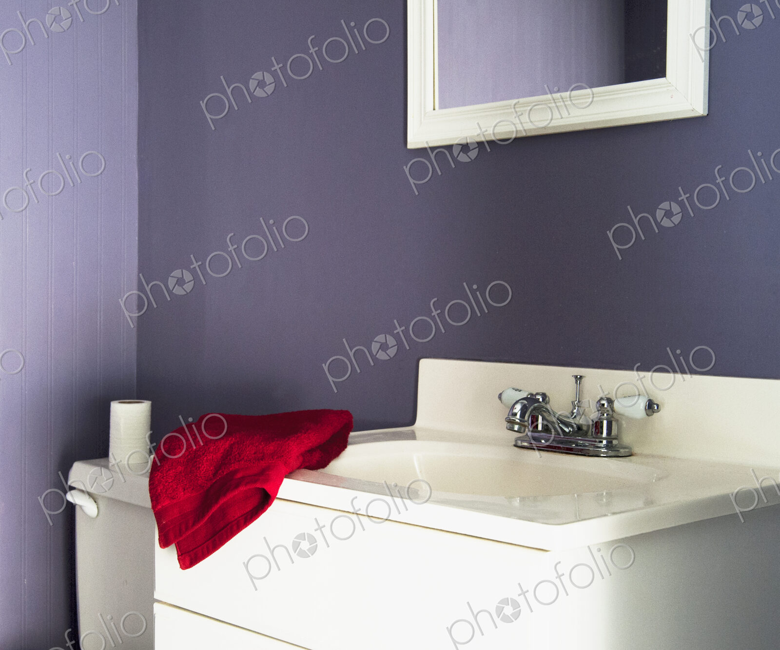 Red towel on sink in modern bathroom