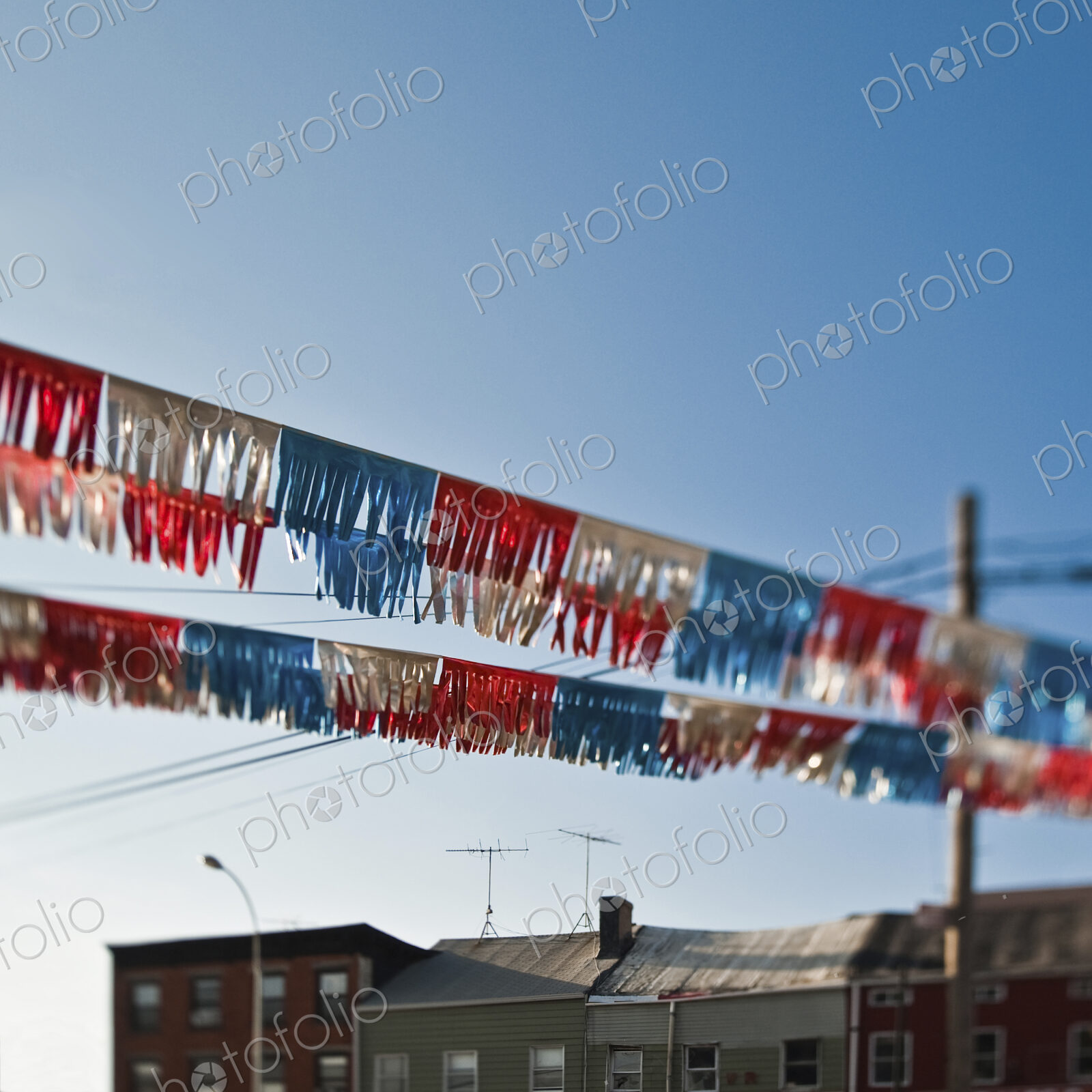 Red, white and blue banner against blue sky