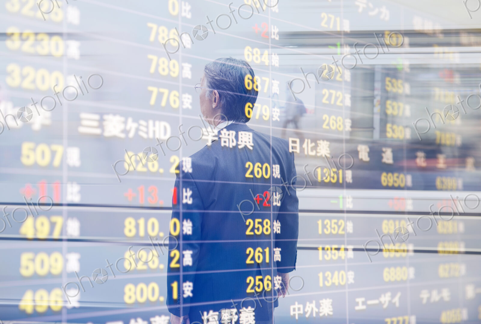 Reflection in glass of man in front of stock exchange information board.