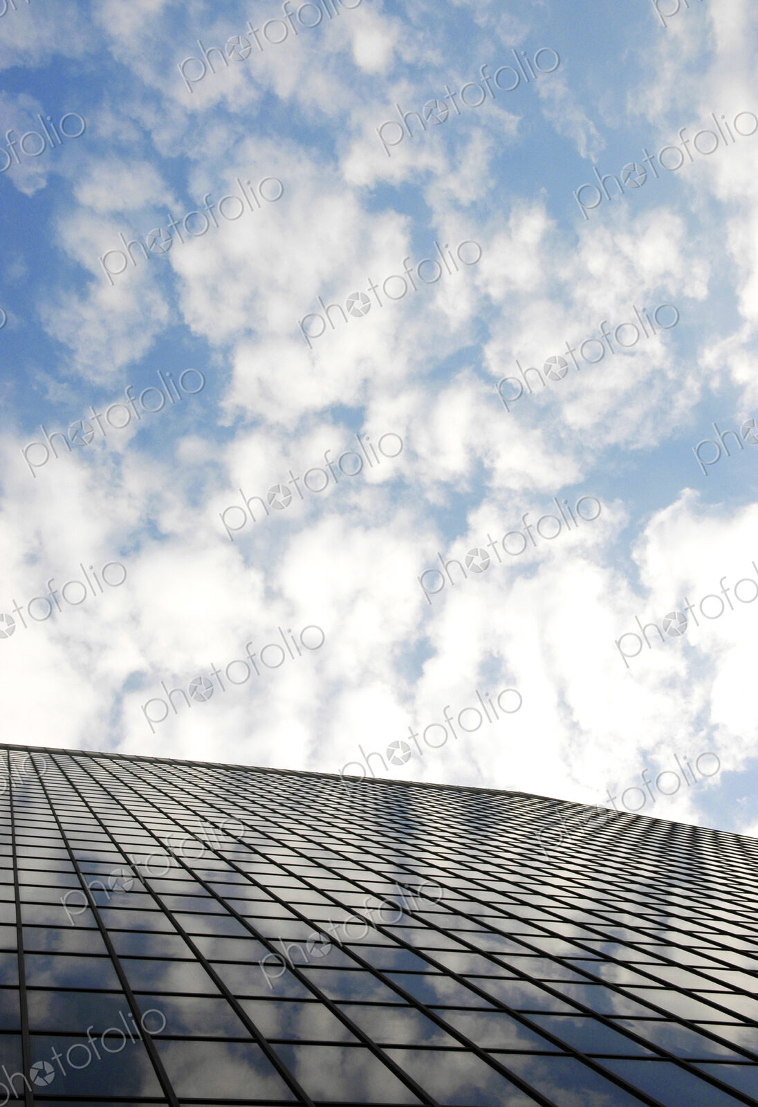 Reflection of clouds on highrise window