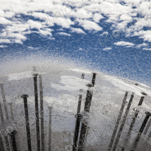 Reflection of sky and clouds in water surface of a modern fountain. Reflection of sky and clouds in water surface of a modern fountain.