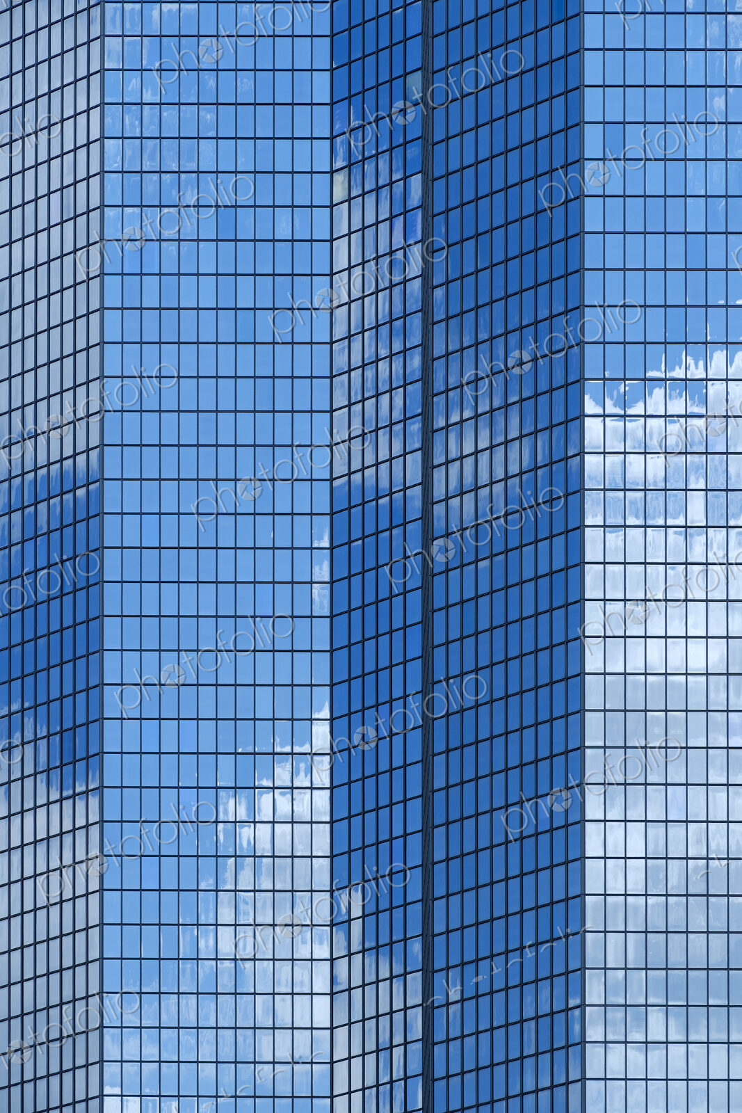 Reflection of sky in high rise skyscraper.