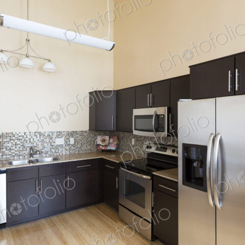 Refrigerator and counter tops in modern kitchen Refrigerator and counter tops in modern kitchen
